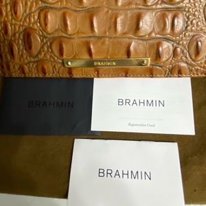 100% Authentic Brahmin croc wallet beautiful condition.